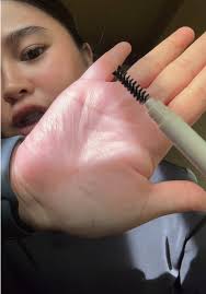 Person with Long Black Hair Adjusting in Stylish Room