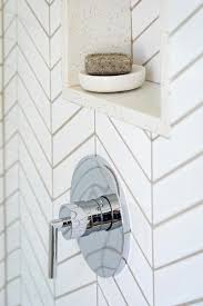 Why install led lighting in your niche? Light Gray Grout With White Herringbone Tiles Transitional Bathroom