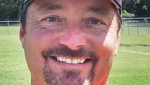 Charleston names May as football coach