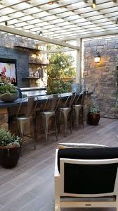 This poised pergola provides just the right amount of shade for the five barstools, while dual white umbrellas cast a shadow on the poolside lounge chairs. 46 Outdoor Bar Areas Ideas Kitchen Inspirations Kitchen Design Kitchen Remodel