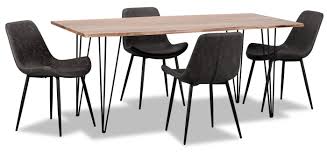 The set includes four chairs and a table, all with retro angled, tapered wood legs. Amita 5 Piece Dining Package Grey The Brick