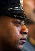 Jersey City Police Officer Marcos Kelly cries during funeral services...  News Photo