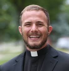 Michael Pederson, SJ, is one of five Midwest Jesuits who professed first  vows in the Society of Jesus this month in St. Paul. Click to see more  photos of Michael and his