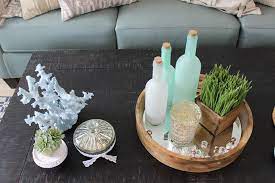 A big bold candle pillar is just right, and bright standout flowers finish the collection. Coffee Table Decor Ideas Guide Ashley Homestore