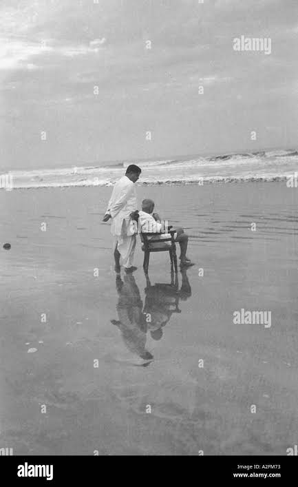 Mahatma Gandhi with his son Devdas at Juhu Beach, Mumbai, Maharashtra, India, Asia, May 1944, old vintage 1900s picture Stock Photo - Alamy