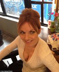 Geri Halliwell posts picture of new beehive hair do... and gaping cleavage  | Daily Mail Online