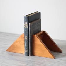 Angular Wood Bookends Wood Bookends Wooden Bookends Bookends Gradually turn the wood blank to a cylinder, increasing the lathe speed as the waste is removed.