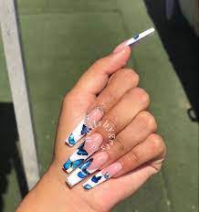 Press on nails with holographic butterfly detail on ring and middle finger these gorgeous press on nails are made, by hand, to order with a shiny gel finish to give that salon fresh look. Blue Acrylic Coffin Butterfly Nails Novocom Top