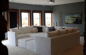 Another way to organize the furniture in a large living room is by creating two or more sitting areas. How To Decorate With Oversized Sofas