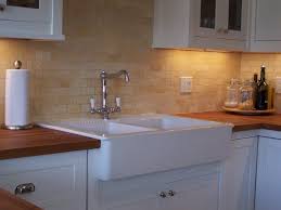 farmhouse sink, white stone backsplash