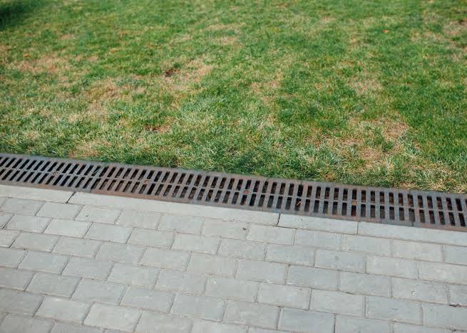 Trench drain installation to control surface runoff
