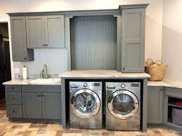 Coming up with a laundry room storage solution for your ironing board can seem impossible; Laundry Room Office Combo