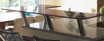 A kitchen island with a double countertop, a taller one is used as a breakfast or drink bar. Glass Breakfast Bars Order Online Glasstops Uk