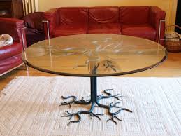 Very design, this lamp and table is made from a hollowed tree trunk with a light and glass plate. Vintage Brutalist Wrought Iron Tree Coffee Table For Sale At Pamono