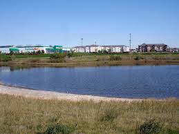 A retention basin, sometimes called a wet pond, wet detention basin or stormwater management pond (swmp), is an artificial pond with vegetation around the perimeter, and includes a permanent pool of water in its design. Retention Basin Wikipedia