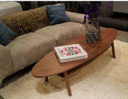 Case in point is the crazy cut oblong coffee table with a segmented surface that will make it a lively element during morning coffee with the newspaper or evening cocktails with your pals. Oblong Coffee Table Walnut Movie Prop Rentals