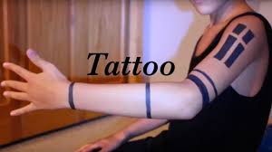 Arm bands tattoo symbolizes mourning and suffering. Tyler Josephs Tattoos Elegant Arts Tattoo