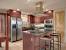 Cherry Kitchen Cabinets With White Countertops