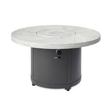 Fire pit tables come in different styles including patio tables with fire pits, dining tables, coffee tables, rectangular tables, round tables and square tables depending on your preferences. The Outdoor Greatroom Company White Onyx Beacon Dining Height Gas Fire Pit Table Just Grillin Outdoor Living