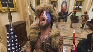 The qanon shaman who wore fur and a horned helmet during the january 6 united states capitol insurrection said his actions were not an attack on the us in his first interview since his arrest on thursday as authorities raise alarms about a possible attack on march 4. Qanon Shaman Says He Regrets Storming Capitol Kyma