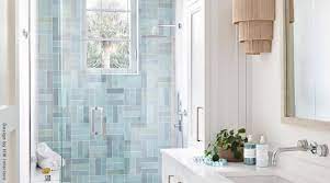Glass walls on two sides of the corner shower make the bathroom feel larger and welcome light from a nearby window. How To Choose Shower Tile Best Tiles For Shower Floors Walls