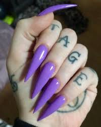 Stiletto nails continue to be a cool nail shape. Long Purple Stiletto Nails Purple Nails Goth Nails Purple Acrylic Nails