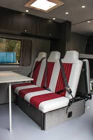 Crash Tested Rock N Roll Bed With Under Bed Storage And Sliding Table Campervan Interior Rock And Roll Bed Van Conversion Interior