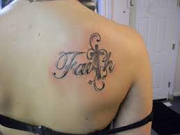 Cross faight tattoo for women on back of the neck. Black And Grey Faith With Cross Tattoo On Girl Upper Back