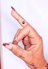 Cross finger tattoo design small yellow ribbon tattoo idea finger tattoo for photography lovers 67 Unique Small Finger Tattoos With Meaning Our Mindful Life