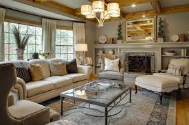 Design ideas for a traditional living room in brisbane with white walls, dark hardwood floors, a standard fireplace, brown floor, coffered and decorative wall panelling. Adding In Some Color Decorist
