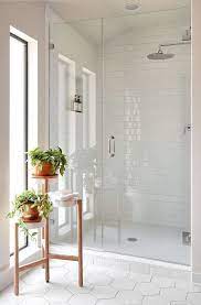 Master ensuite with its calacatta marbled vanity counter and undermount sinks. Bathroom Trens In 2020 What S In And What S Out Modern White Bathroom Bathroom Remodel Master Bathroom Tile Designs
