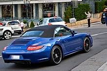 Its elegant flowing shape incorporates large spaces between the spokes. Porsche 997 Wikipedia