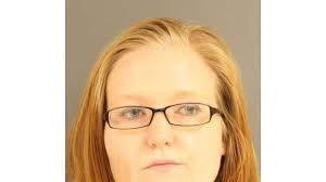 Judge sets $100K bond for woman charged in beating death