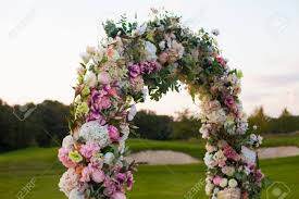 Check spelling or type a new query. Beautiful Floral Arch With Lots Of Small Pink Purple And White Flowers On The Green Field On The Backgroung Of The Forest Stock Photo Picture And Royalty Free Image Image 63777008