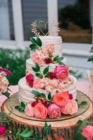 Beautiful Wedding Cakes Three Tiered White Cake With Fresh Flowers And A Golden Heart On Top Wedding Cake Toppers Midsummer Nights Dream Wedding Wedding Cakes