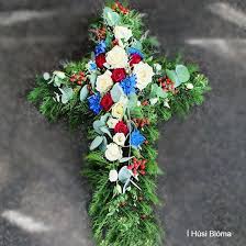 All funeral directors near me funeral directors in london funeral directors in manchester funeral directors in. Beautifuly Decorated Funeral Cross With White Red Blue Flowers Berries And More 70cm I Husi Bloma Flower Delivery Shop Iceland