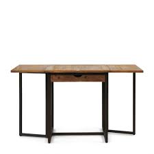 Enrich the elegance of your dining area with this dining table that features a wood texture tabletop and a pedestal. Buy Shelter Island Folding Dining Table Riviera Maison