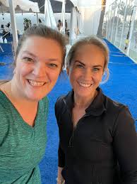 You see a young woman in London wearing a UC Davis water polo tee