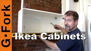 A ledger is a board that helps support the cabinetry as you work. Hang Ikea Cabinets Gardenfork Youtube
