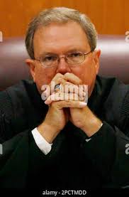 Circuit Judge Ric Howard listens to arguments prior to the beginning of  jury selection at the Lake County Judicial Center in Tavares, Fla., Monday,  July 10, 2006, where John Evander Couey is accused of kidnapping, raping  and killing 9-year-old Jessica ...