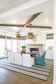 This kitchen offers marble countertops on both kitchen counters and center island. The Tray Ceiling Combines Crossed X Beams With Tongue And Groove Beadboard