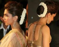 Deepika Padukone With Hair Bun And Flowers Indian Bridal Hairstyles Womens Hairstyles Indian Hairstyles