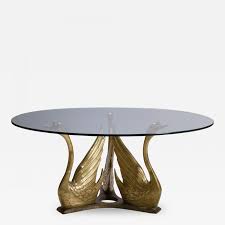 The acacia coffee table is an ideal way to add functional style to your outdoor living area thanks to its charming appearance and weather resistance. Maison Jansen French Brass Seated Swan Base Cocktail Table