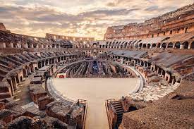 Scenic View Of Roman Colosseum Interior At Sunset Scenic Views Italy Tourism Colosseum