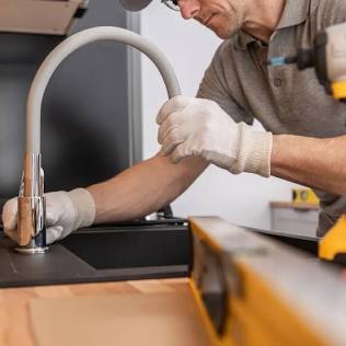 Swapping out a kitchen faucet is a highly approachable plumbing project., AI generated