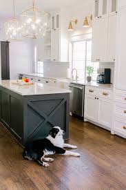 Two Toned Kitchens Modern Farmhouse With Black Island And White Cabinets Farmhouse In 2020 Modern Farmhouse Kitchens Farmhouse Style Kitchen Farm House Living Room