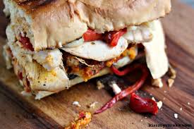 Grilled Smoked Chicken Sandwich With Roasted Red Peppers Mozzarella And Pepper Pesto
