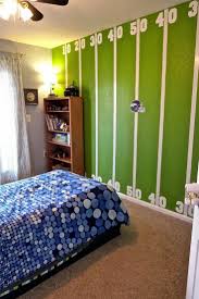 Breathtaking American Football Themed Kids Room Design This Wall Paper Is Very Impressive W Football Bedroom Football Bedroom Decor Sports Themed Boy Bedroom