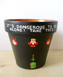 The Legend Of Zelda It S Dangerous To Go Alone Legend Of Zelda Painted Flower Pot It S Dangerous To Go Alone Nintendo Nes Zelda Birthday Zelda Party Nintendo Party