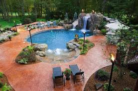 Once the concrete cures, the pool is plastered, painted and finished with a textured. Breathtaking Pool Waterfall Design Ideas